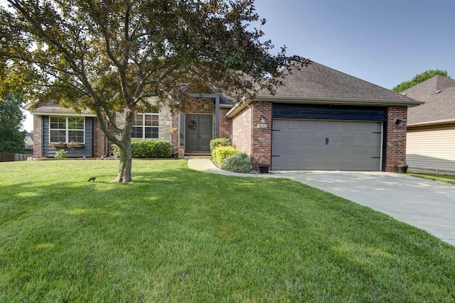 5052 E Cherry Pl, Springfield, MO 65809 - obstructed view of property with concrete driveway, an attached garage, a front yard, and brick siding