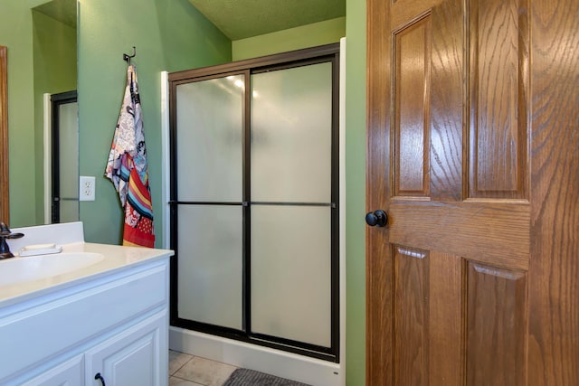 5052 E Cherry Pl, Springfield, MO 65809 - bathroom featuring a shower stall, vanity, and tile patterned floors
