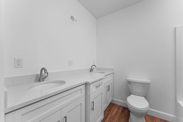 680 Highpoints Rdg, Branson, MO 65616 - bathroom with toilet, wood finished floors, double vanity, and baseboards