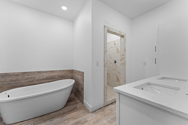 680 Highpoints Rdg, Branson, MO 65616 - bathroom featuring a tile shower, a soaking tub, wood finished floors, vanity, and tile walls