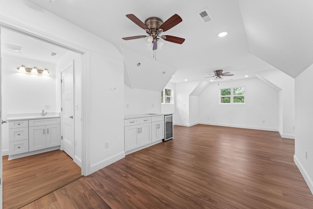 680 Highpoints Rdg, Branson, MO 65616 - unfurnished living room featuring beverage cooler, a ceiling fan, wood finished floors, lofted ceiling, and a sink