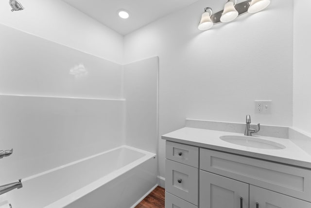 680 Highpoints Rdg, Branson, MO 65616 - bathroom featuring vanity, wood finished floors, and tub / shower combination