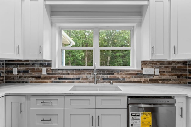 680 Highpoints Rdg, Branson, MO 65616 - kitchen with dishwashing machine, a sink, white cabinets, decorative backsplash, and light stone counters