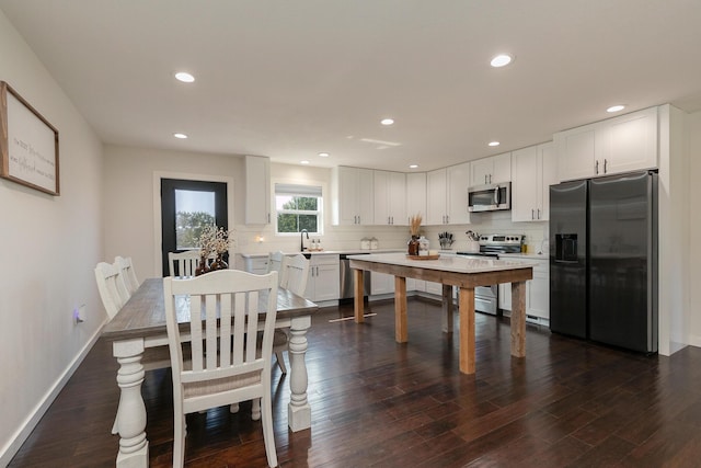 777 S Elm St, Marshfield, MO 65706 - dining room featuring dark wood finished floors and recessed lighting