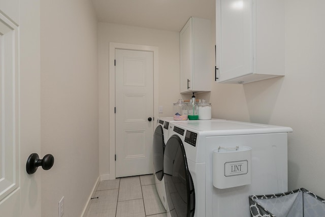 777 S Elm St, Marshfield, MO 65706 - laundry room featuring cabinet space and washing machine and clothes dryer