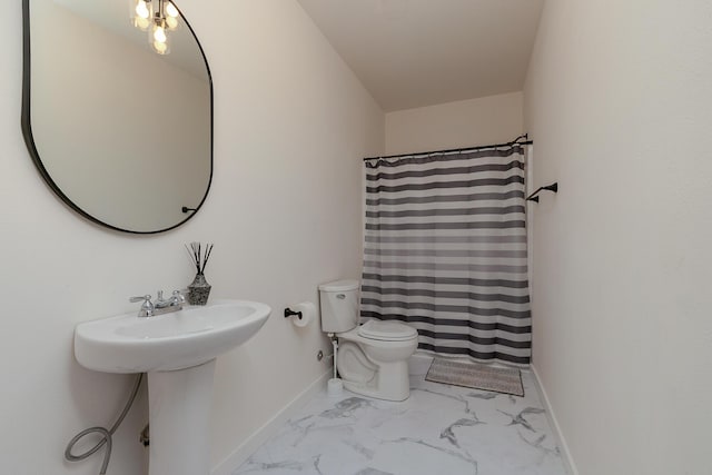 777 S Elm St, Marshfield, MO 65706 - bathroom featuring marble look tiles and a shower with curtain