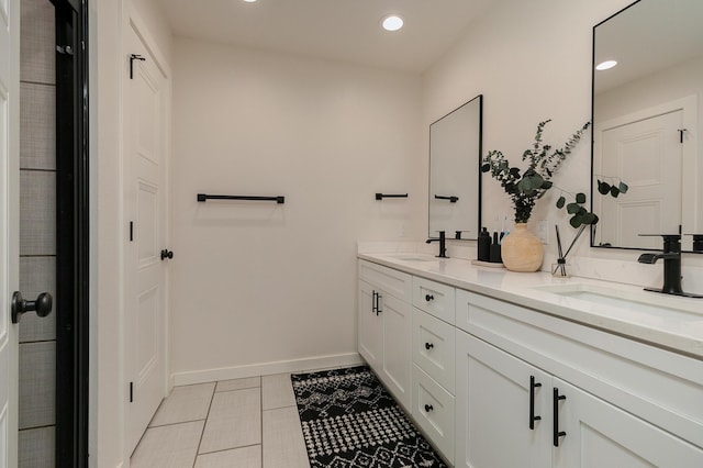 777 S Elm St, Marshfield, MO 65706 - full bathroom with double vanity, tile patterned floors, and recessed lighting