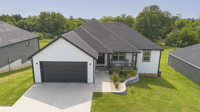 777 S Elm St, Marshfield, MO 65706 - view of front of home with an attached garage, driveway, a front yard, and a porch