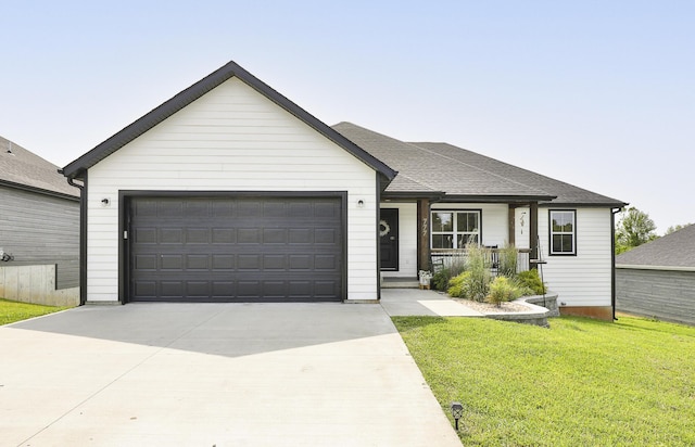 777 S Elm St, Marshfield, MO 65706 - single story home featuring a front yard, a garage, concrete driveway, a porch, and a shingled roof