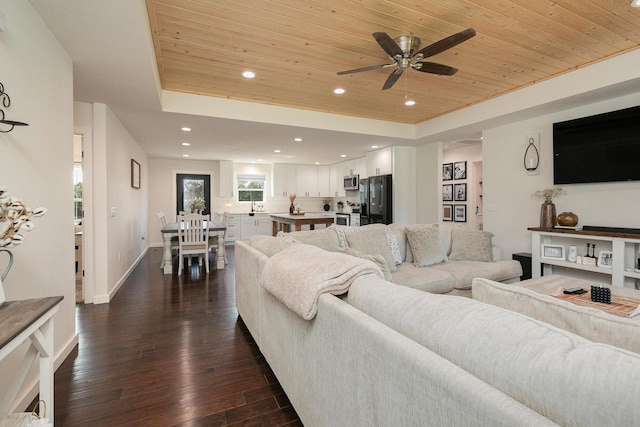 777 S Elm St, Marshfield, MO 65706 - living room featuring wooden ceiling, a tray ceiling, dark wood-style floors, ceiling fan, and recessed lighting