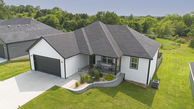 777 S Elm St, Marshfield, MO 65706 - view of front facade with an attached garage, concrete driveway, and a front yard