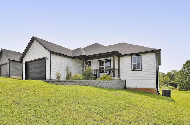 777 S Elm St, Marshfield, MO 65706 - view of front of house featuring a garage, covered porch, a front lawn, and roof with shingles