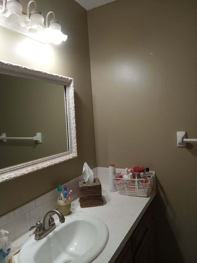1361 E Dunkirk St, Springfield, MO 65804 - bathroom featuring vanity and decorative backsplash