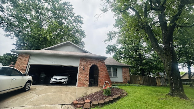 1361 E Dunkirk St, Springfield, MO 65804 - ranch-style home with brick siding, concrete driveway, an attached garage, and a shingled roof