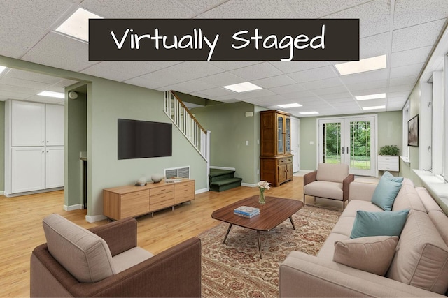 13544 State Highway Kk, Marshfield, MO 65706 - living area with a paneled ceiling, light wood finished floors, and stairway