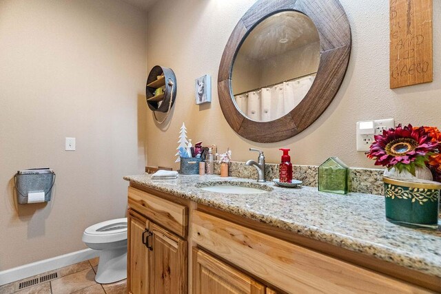6 Glory Ln, Blue Eye, MO 65611 - bathroom with toilet, vanity, baseboards, and tile patterned flooring