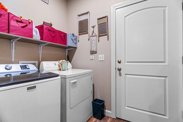 6 Glory Ln, Blue Eye, MO 65611 - laundry area featuring washer and clothes dryer, light wood-type flooring, and baseboards