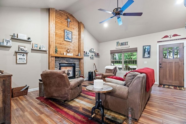 6 Glory Ln, Blue Eye, MO 65611 - living room featuring a ceiling fan, a stone fireplace, wood finished floors, high vaulted ceiling, and baseboards
