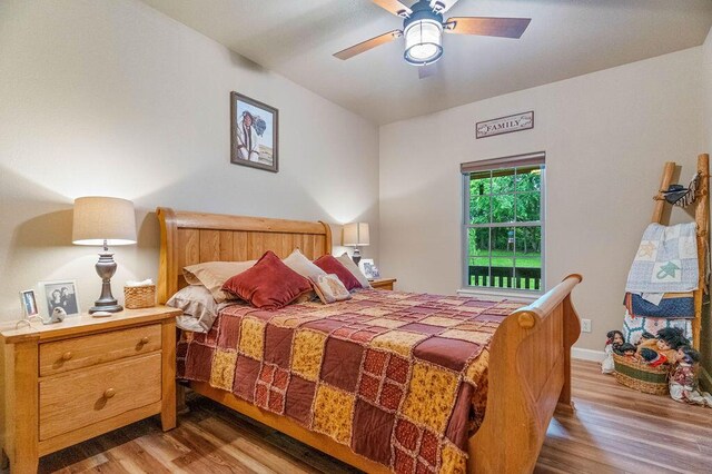 6 Glory Ln, Blue Eye, MO 65611 - bedroom featuring wood finished floors, ceiling fan, and baseboards
