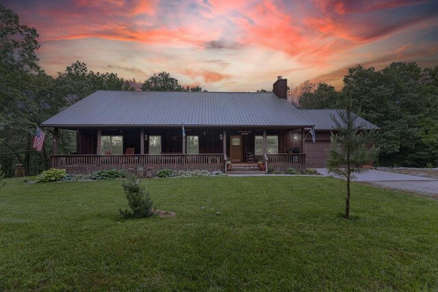 6 Glory Ln, Blue Eye, MO 65611 - view of front of property with covered porch, a chimney, a lawn, and driveway