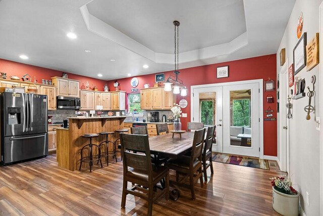 6 Glory Ln, Blue Eye, MO 65611 - dining room with a raised ceiling, wood finished floors, french doors, and recessed lighting