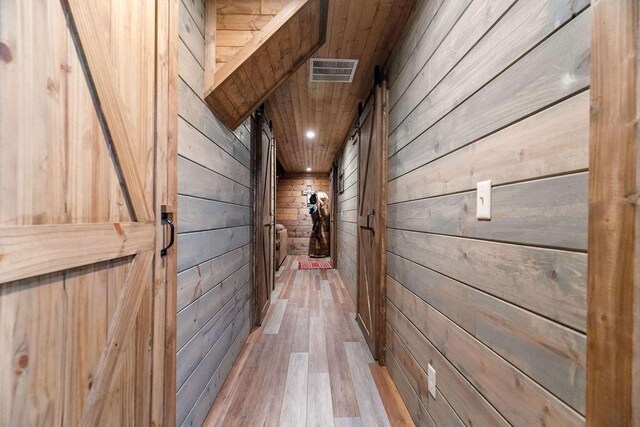 6 Glory Ln, Blue Eye, MO 65611 - hallway featuring wood walls and wood finished floors