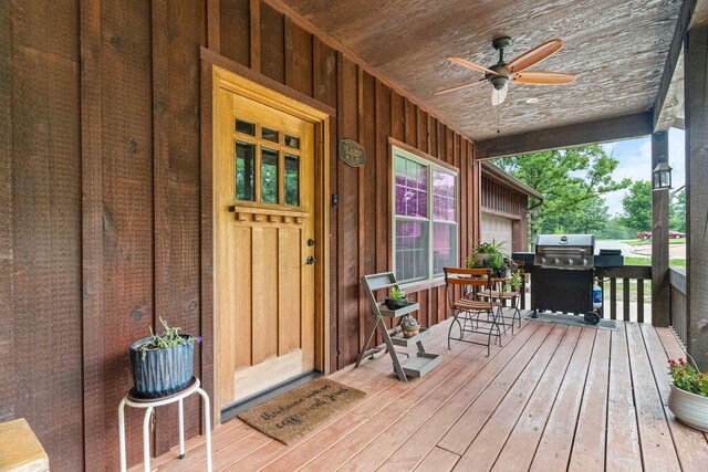 6 Glory Ln, Blue Eye, MO 65611 - view of exterior entry featuring a porch, ceiling fan, and board and batten siding
