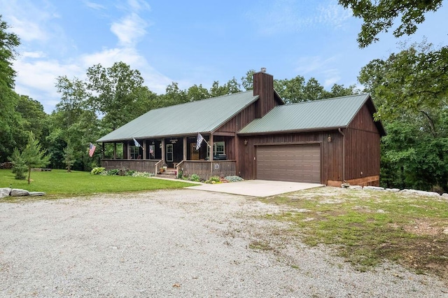 6 Glory Ln, Blue Eye, MO 65611 - rustic home featuring a porch, concrete driveway, an attached garage, a front yard, and a chimney