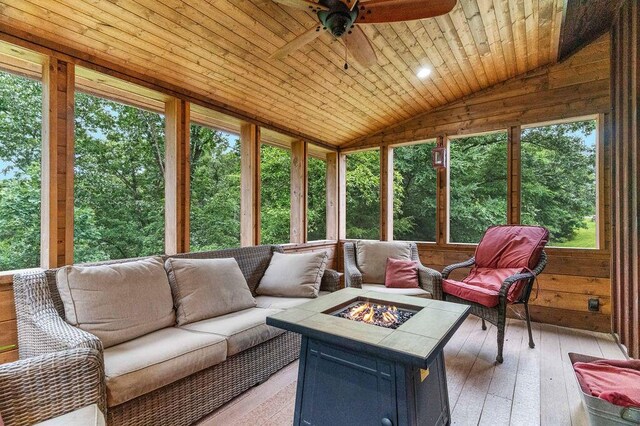 6 Glory Ln, Blue Eye, MO 65611 - sunroom with a ceiling fan, an outdoor living space with a fire pit, and lofted ceiling