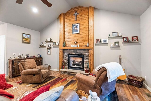 6 Glory Ln, Blue Eye, MO 65611 - living room featuring vaulted ceiling, wood finished floors, a stone fireplace, ceiling fan, and baseboards