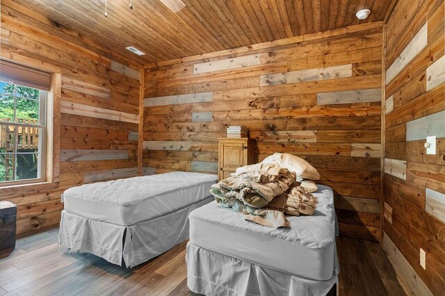 6 Glory Ln, Blue Eye, MO 65611 - bedroom featuring wood walls, wooden ceiling, and wood finished floors