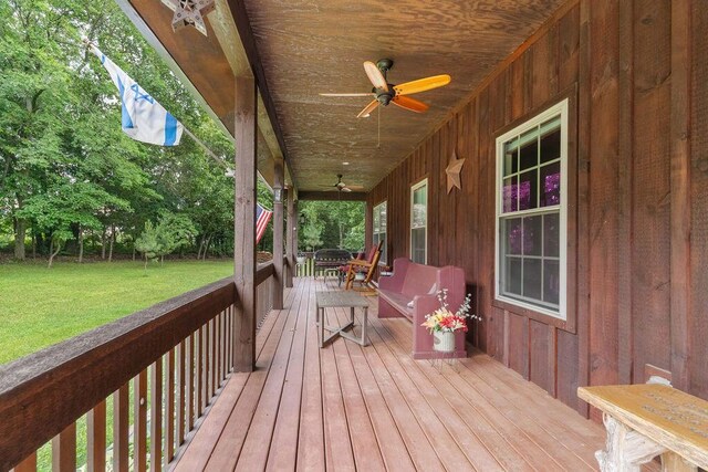 6 Glory Ln, Blue Eye, MO 65611 - wooden terrace with ceiling fan and a yard