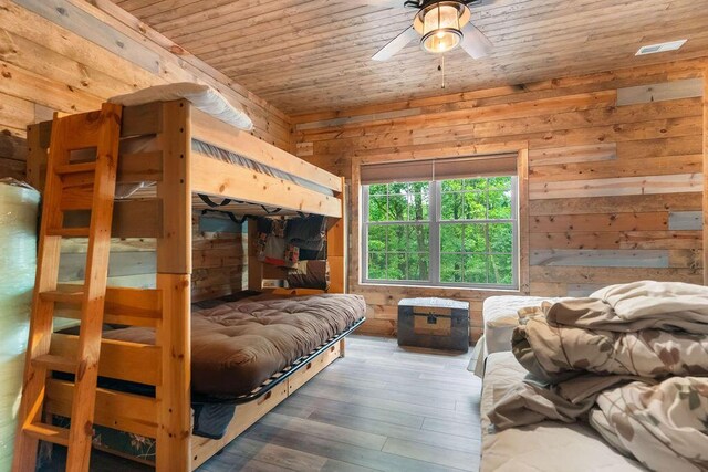 6 Glory Ln, Blue Eye, MO 65611 - bedroom with wooden walls, wood ceiling, wood finished floors, and a ceiling fan