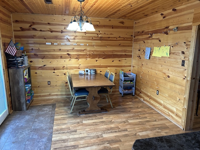 23700 E State Highway 76, Rocky Comfort, MO 64861 - dining room featuring a chandelier, wooden walls, wood ceiling, and wood finished floors