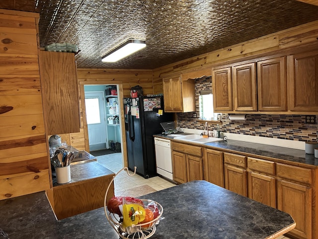 23700 E State Highway 76, Rocky Comfort, MO 64861 - kitchen featuring white dishwasher, an ornate ceiling, a sink, black fridge, and tasteful backsplash