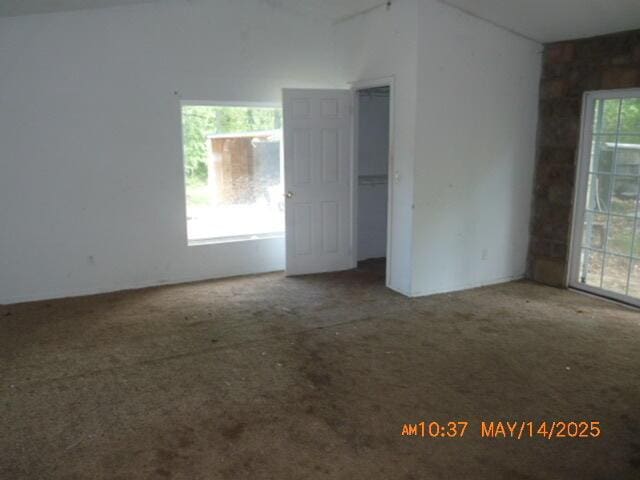 1098 Sundown Ln, Forsyth, MO 65653 - spare room with lofted ceiling and carpet