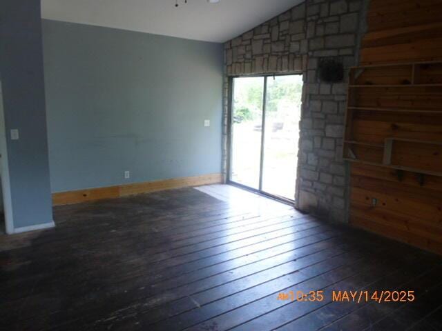 1098 Sundown Ln, Forsyth, MO 65653 - spare room featuring vaulted ceiling, wood-type flooring, and baseboards