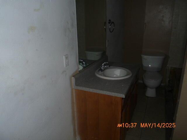 1098 Sundown Ln, Forsyth, MO 65653 - bathroom featuring vanity, toilet, and tile patterned floors