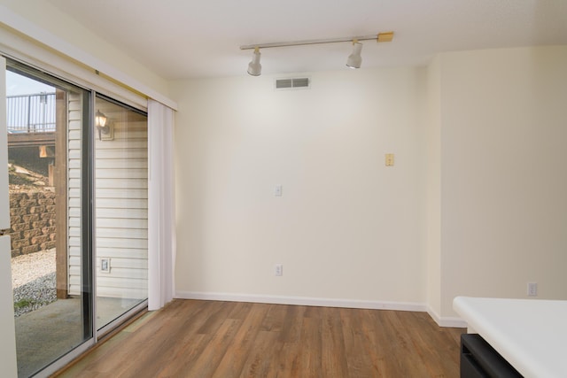 118 Vixen Cir Unit D, Branson, MO 65616 - unfurnished room featuring wood finished floors, rail lighting, and baseboards