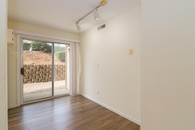 118 Vixen Cir Unit D, Branson, MO 65616 - empty room with wood finished floors, rail lighting, and baseboards