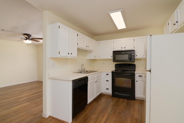 118 Vixen Cir Unit D, Branson, MO 65616 - kitchen featuring black appliances, a sink, dark wood finished floors, and white cabinetry