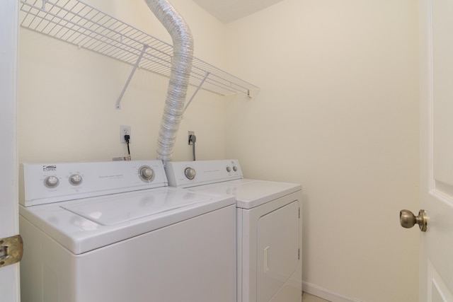 118 Vixen Cir Unit D, Branson, MO 65616 - laundry room with washing machine and clothes dryer and baseboards