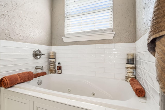 22 Kinder Ln, Rogersville, MO 65742 - full bathroom featuring a jetted tub and a textured wall