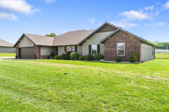 22 Kinder Ln, Rogersville, MO 65742 - ranch-style home with brick siding, a front lawn, an attached garage, roof with shingles, and driveway