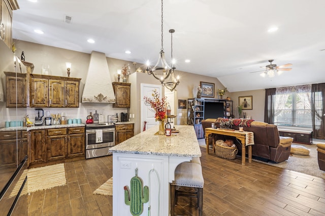 22 Kinder Ln, Rogersville, MO 65742 - kitchen featuring stainless steel range with electric stovetop, custom range hood, dark wood finished floors, a ceiling fan, and a kitchen island
