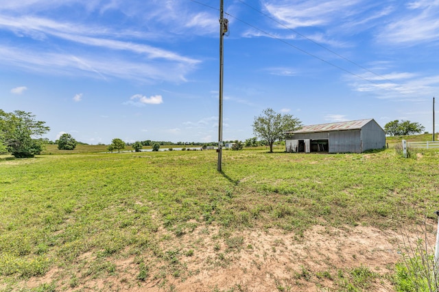 32 State Road F, Buffalo, MO 65622 - view of green lawn featuring an outbuilding, an outdoor structure, and a view of rural / pastoral area