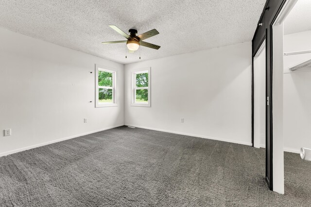 32 State Road F, Buffalo, MO 65622 - unfurnished bedroom featuring dark colored carpet, a textured ceiling, baseboards, ceiling fan, and a closet
