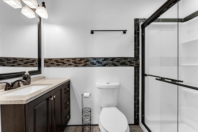 32 State Road F, Buffalo, MO 65622 - bathroom with tile walls, toilet, vanity, and a stall shower