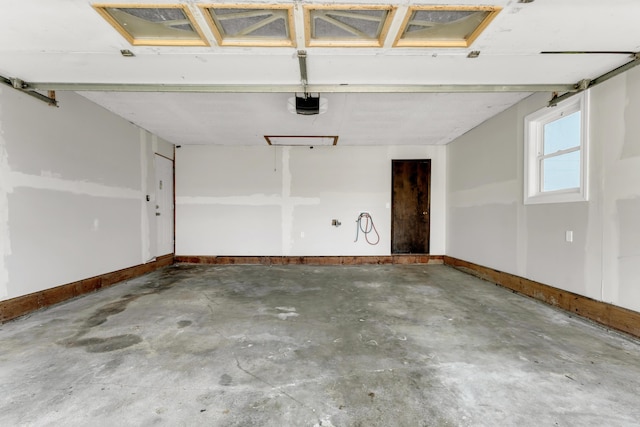 32 State Road F, Buffalo, MO 65622 - garage featuring a garage door opener and baseboards