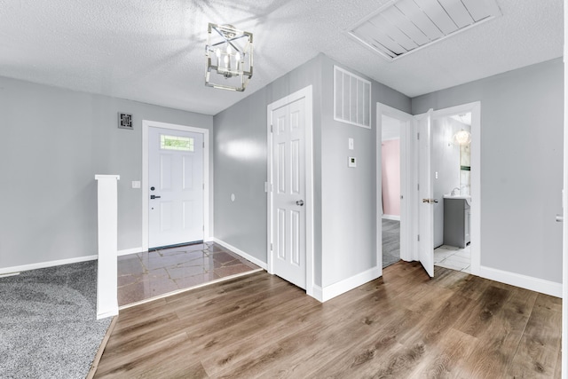 32 State Road F, Buffalo, MO 65622 - foyer entrance featuring baseboards, a textured ceiling, and wood finished floors